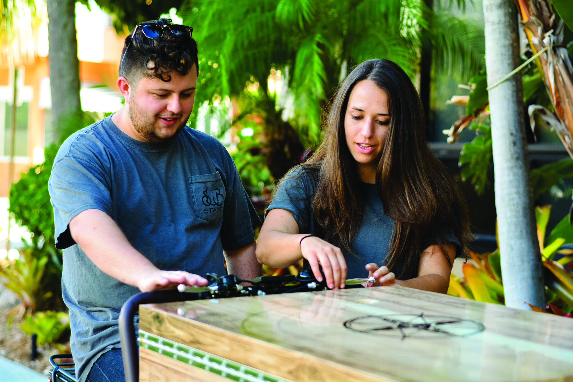 Amy Schatzman and one of her start-up employees with a Seaside Brew cart