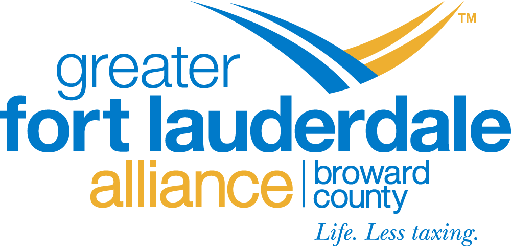 Logo for the Greater Fort Lauderdale Alliance, Broward County, with blue and gold text and swoosh graphics. The tagline reads "Life. Less taxing. South Florida Business & Wealth