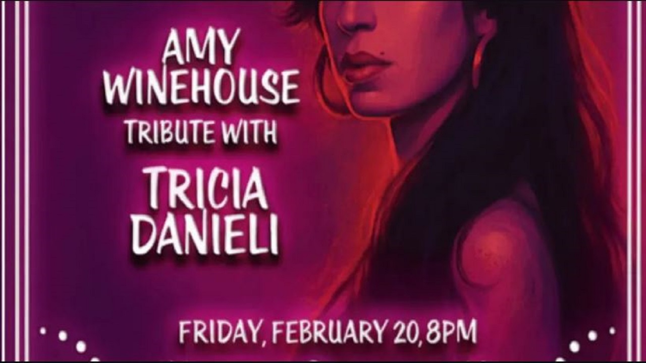 A poster with a portrait illustration of a woman and text: "Amy Winehouse Tribute with Tricia Danieli. Friday, February 20, 8 PM." The background is pink and purple with decorative white accents. South Florida Business & Wealth
