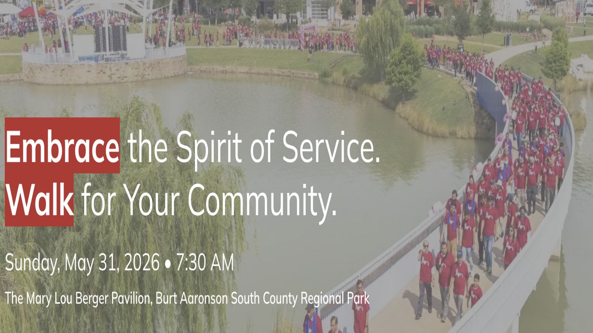 A large group of people wearing red shirts walk across a curved bridge over a pond in a park. Text reads: "Embrace the Spirit of Service. Walk for Your Community. Sunday, May 31, 2026 • 7:30 AM. South Florida Business & Wealth