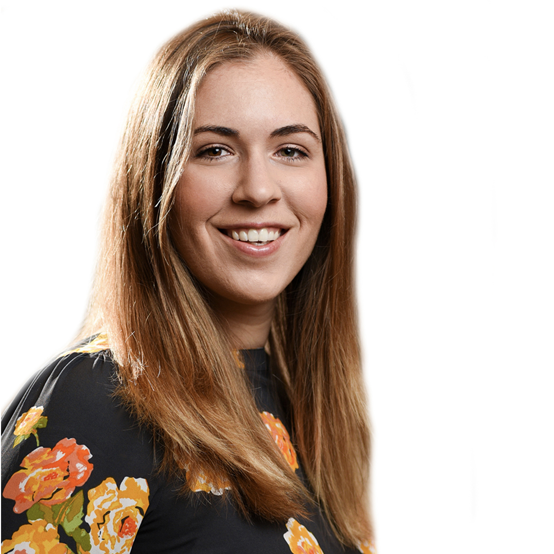 A young woman with long, straight light brown hair, smiling and wearing a dark floral top with orange and yellow flowers, posed against a plain white background. South Florida Business & Wealth