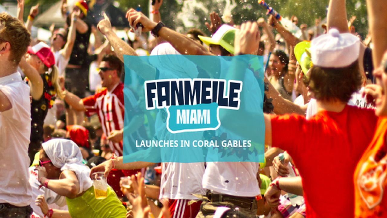 Crowd of energetic people celebrating outdoors, some in costumes and hats, with "Fanmeile Miami launches in Coral Gables" text displayed over the scene. South Florida Business & Wealth