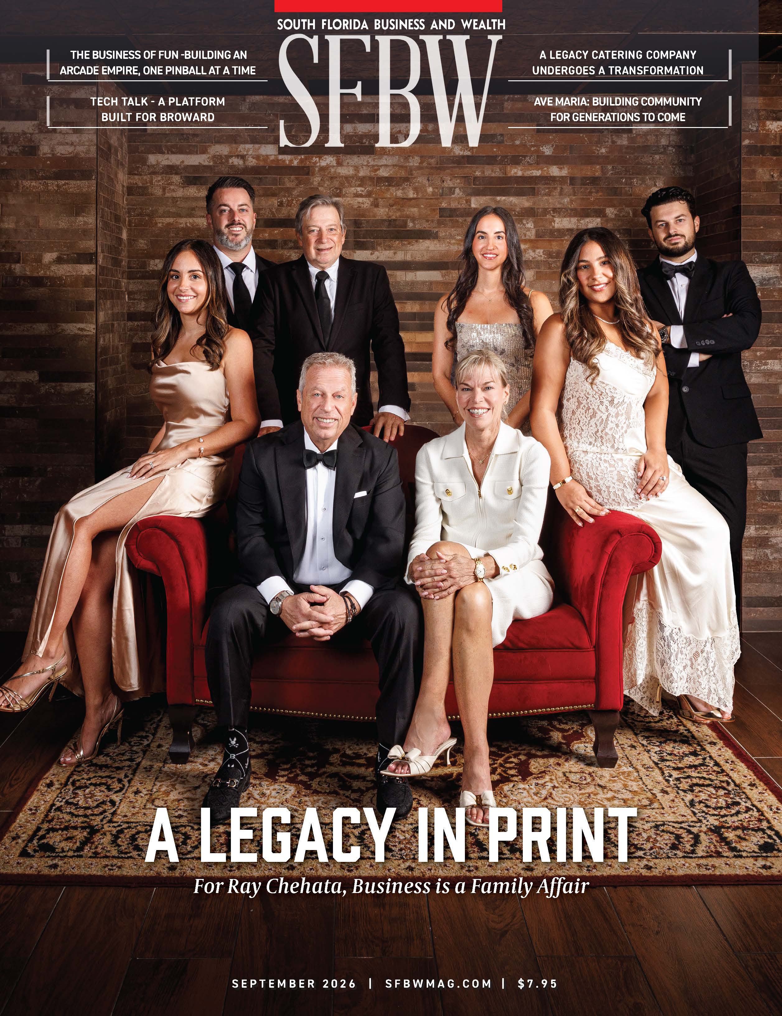 Eight people, dressed formally, pose together in a wood-paneled room for a magazine cover titled “A Legacy in Print.” Two are seated in front while six stand behind them, all smiling at the camera. South Florida Business & Wealth