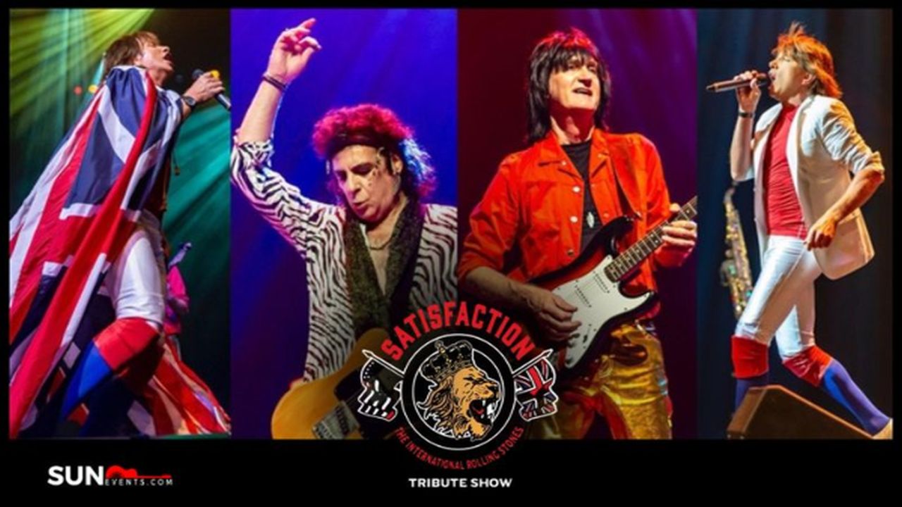 Four musicians perform on stage, dressed in colorful, retro outfits. The center logo reads “Satisfaction: International Rolling Stones Tribute Show” with a lion. Bright stage lights illuminate each performer. South Florida Business & Wealth