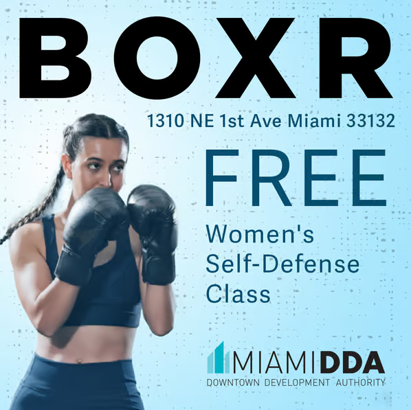 A woman wearing boxing gloves stands in front of text promoting a free women’s self-defense at BOXR, 1310 NE 1st Ave, Miami, hosted by Miami DDA. South Florida Business & Wealth